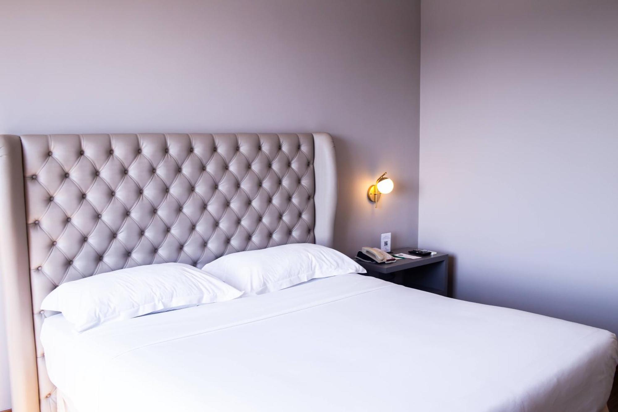 Ouro Minas Hotel Belo Horizonte, Dolce By Wyndham Экстерьер фото A bedroom at the hotel